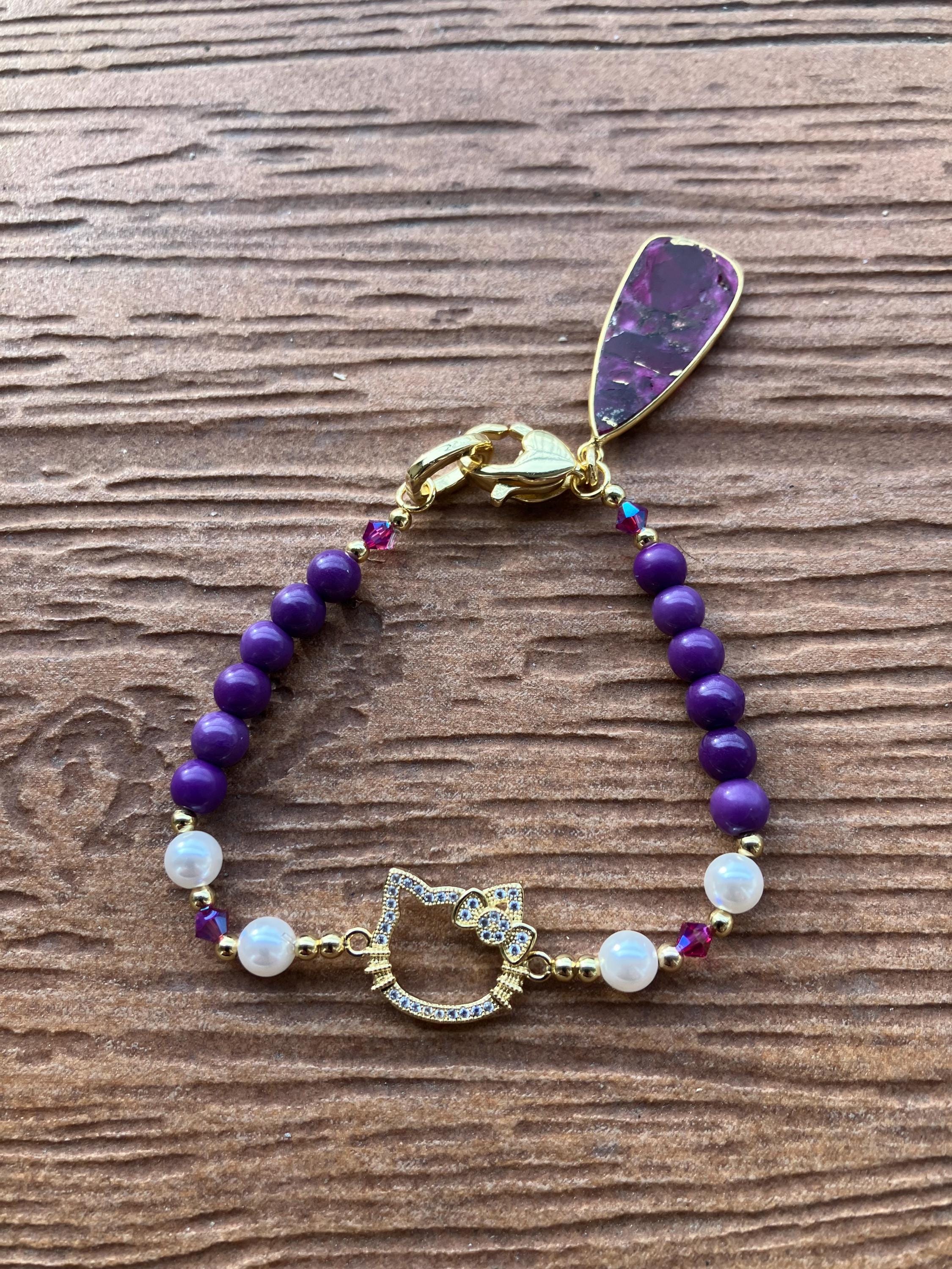 bracelet original chat en aurifie et perles semi précieuse phosphosiderite et rubis moyave, nacre et cristal Swarovski